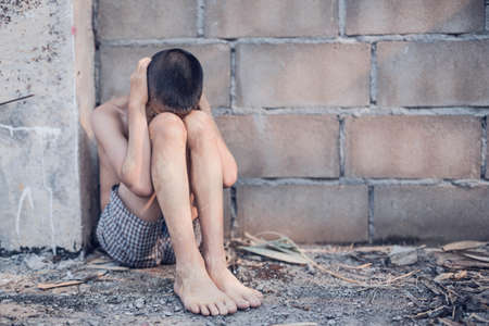 boy of a victim tied up with ropeの写真素材