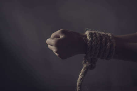 boy of a victim tied up with rope