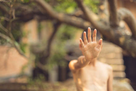 boy of a victim tied up with ropeの写真素材