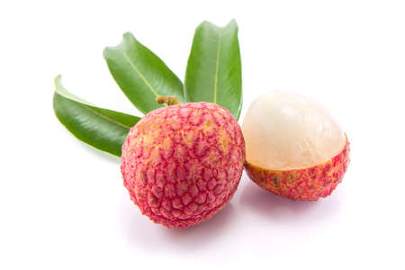 Sweet Lychees fruits with leaves close up isolated on white backgroundの写真素材