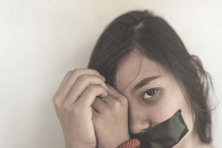 Women of a victim tied up with ropeの写真素材