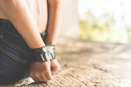 Women of a victim tied up with ropeの写真素材
