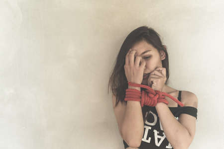 Women of a victim tied up with ropeの写真素材