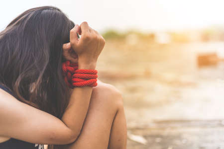 Women of a victim tied up with ropeの写真素材