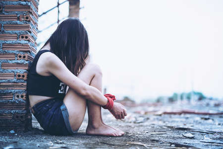 Women of a victim tied up with ropeの写真素材
