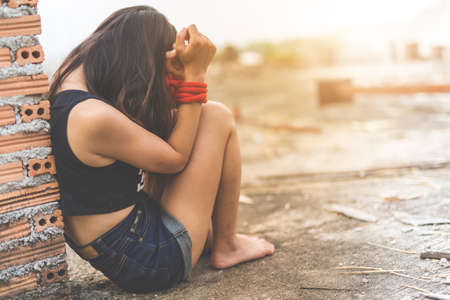 Women of a victim tied up with rope