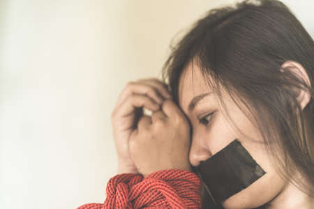 Women of a victim tied up with ropeの写真素材