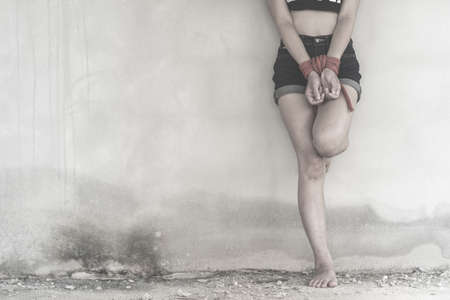 Women of a victim tied up with ropeの写真素材