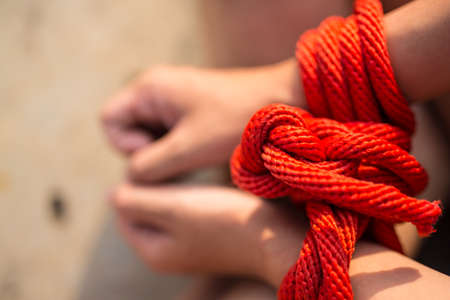 Women of a victim tied up with ropeの写真素材