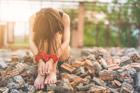 Women of a victim tied up with ropeの写真素材