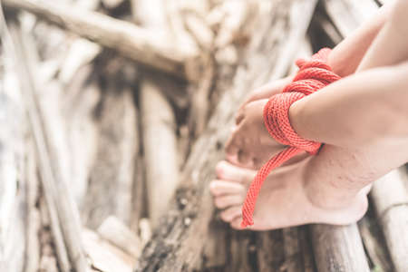 Women of a victim tied up with ropeの写真素材