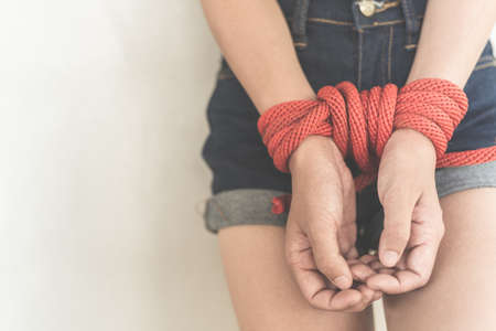 Women of a victim tied up with ropeの写真素材