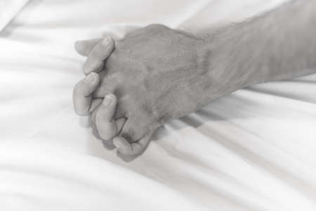 woman sit on a bed in a bedroom - concept photo of Sexual assaultの写真素材