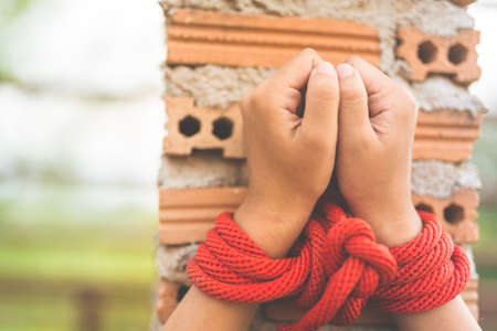 Women of a victim tied up with ropeの写真素材