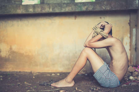 Stop abusing boy violence. child bondage in angle image blur , Human Rights Day concept.の写真素材