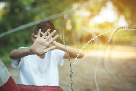 Stop abusing boy violence. child bondage in angle image blur , Human Rights Day concept.の写真素材
