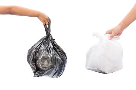 Female and children hand holding garbage bag isolated on white backgroundの写真素材