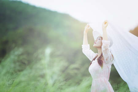 Woman relaxing in the meadow Vintage styleの写真素材