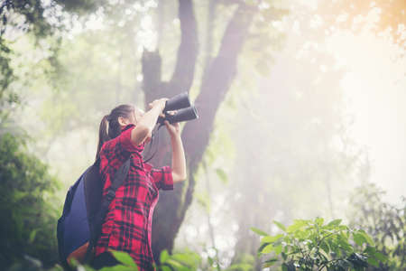 hiking,adventure, travel, tourism.Woman telescopic Hiking trip.の写真素材