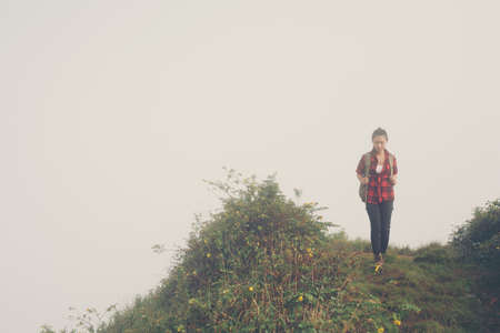 woman traveler with backpack hiking in young hiking holiday.adventure, travel, tourism.の写真素材
