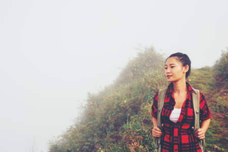 woman traveler with backpack hiking in young hiking holiday.adventure, travel, tourism.の写真素材