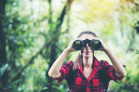Women hiking telescope.hiking,adventure, travel, tourism.の写真素材