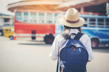 happy female tourist on map to Bus station vacation.の写真素材