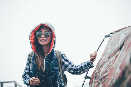 Happy woman tourist to travel in wild trip  hiking during vacation.Travel concept.の写真素材
