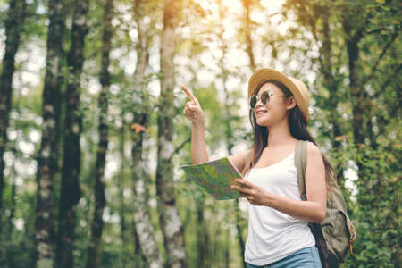 happy female tourist  to travel on atlas in hiking during vacation.Travel concept.の写真素材