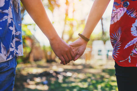 Couples holding hands.Summer in love, Valentine's Day Concept.の写真素材