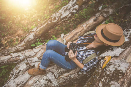 Girl traveling with a backpack on the forest, Hiking concept.の写真素材