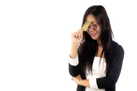 Businesswoman in suit holding showing business smart card isolated on white background.の写真素材