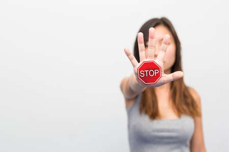 Stop, Woman standing with outstretched hand showing stop, Violence concept.の写真素材