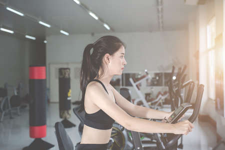 Fitness woman health exercise at gym. Healthy workout concepts.