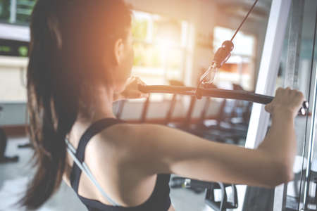 Fitness woman health exercise at gym. Healthy workout concepts.