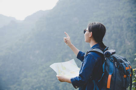 Travelers walking along the road map.の写真素材