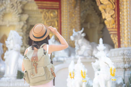 Female tourists travel in temples.の写真素材