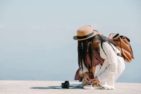 Female tourists who are taking photos of the atmosphere and smile happily.