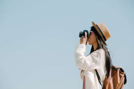 Female tourists who are taking photos of the atmosphere and smile happily.