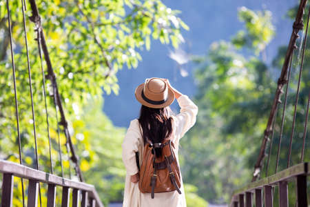 Female tourists spread their arms and held their wings, smiling happily.の写真素材