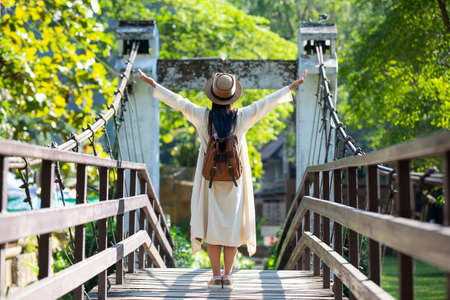 Female tourists spread their arms and held their wings, smiling happily.の写真素材