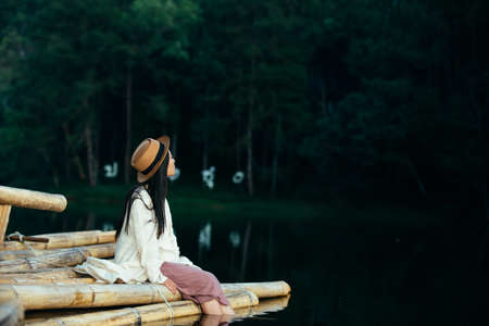 Female tourists spread their arms and held their wings, smiling happily.の写真素材
