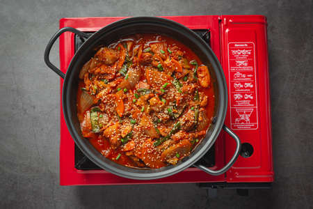 chicken fried in hot pot with spicy sauce in korean style