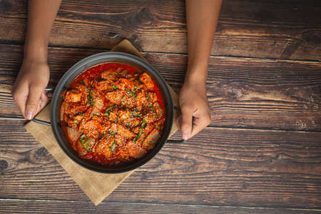 chicken fried in hot pot with spicy sauce in korean style