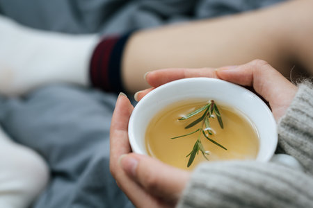 Sipping herbal tea on a cold dayの写真素材