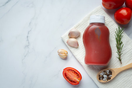 ketchup or tomato sauce with fresh tomatoの写真素材