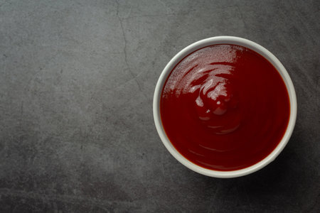 ketchup or tomato sauce with fresh tomatoの写真素材