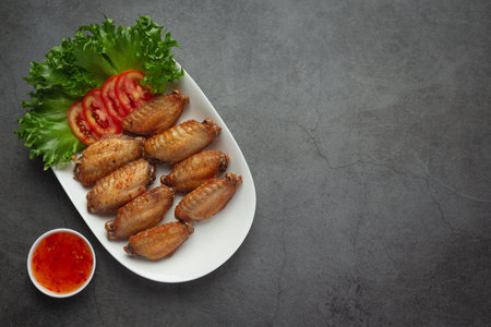 Fried chicken wings in fish Sauceの写真素材