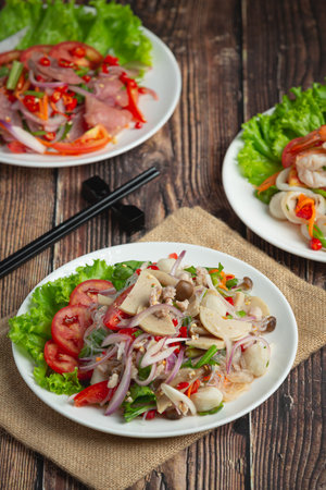 Thai food ;mixed spicy pork sausage salad with vermicelli noodleの写真素材