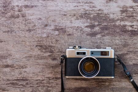 Old camera on wooden backgroundの写真素材